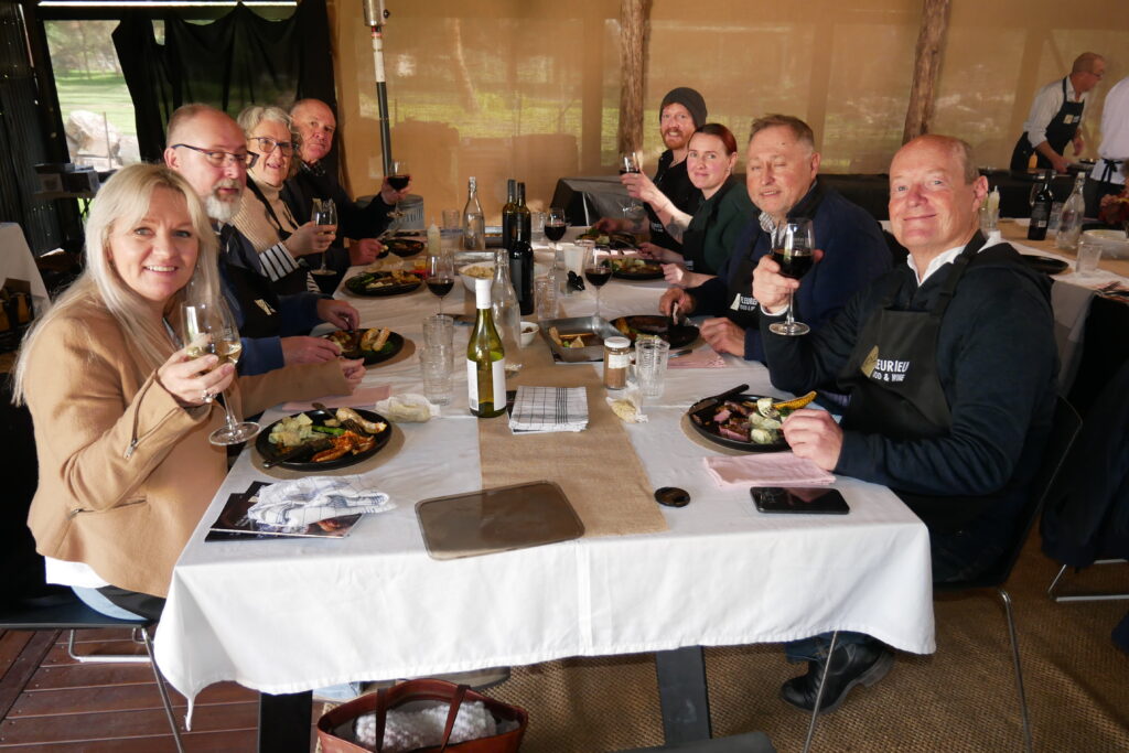 Guests raising a glass over the long lunch that finishes the Steak Masterclass at Bungala House