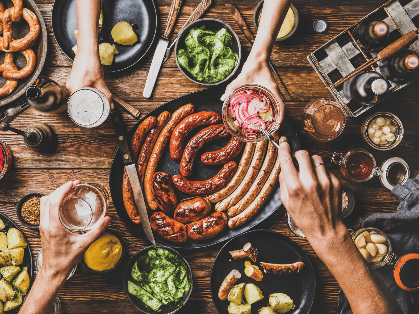Sausages and fresh produce laid out on the bench at the Sausage Making Masterclass