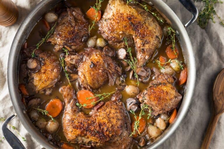 Succulent Coq au Vin chicken with vegetables from Fleurieu Food & Wine, perfect for wine pairing.