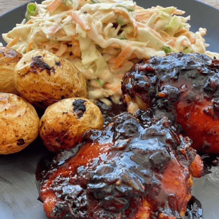 Freshly prepared BBQ chicken with dark cherry glaze, served with coleslaw and roast potatoes at Fleurieu Food & Wine.