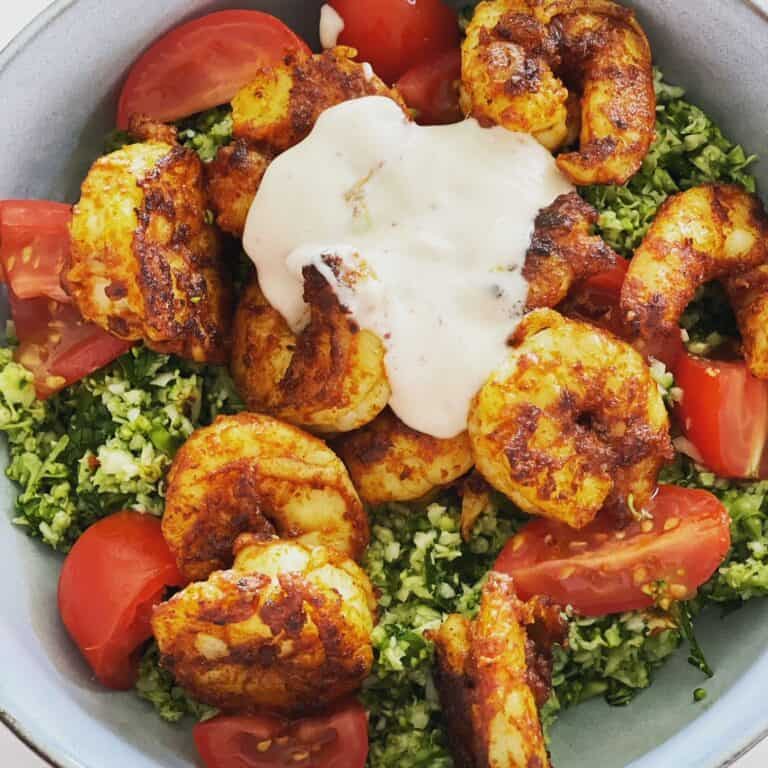Spicy grilled shrimp salad with fresh tomatoes, herbs, and creamy dressing, perfect for wine pairing in Fleurieu.