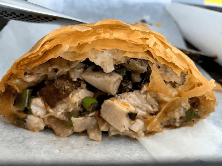 Savory chicken pot pie with flaky golden pastry, loaded with tender chicken and vegetables. Perfect for comfort food lovers.