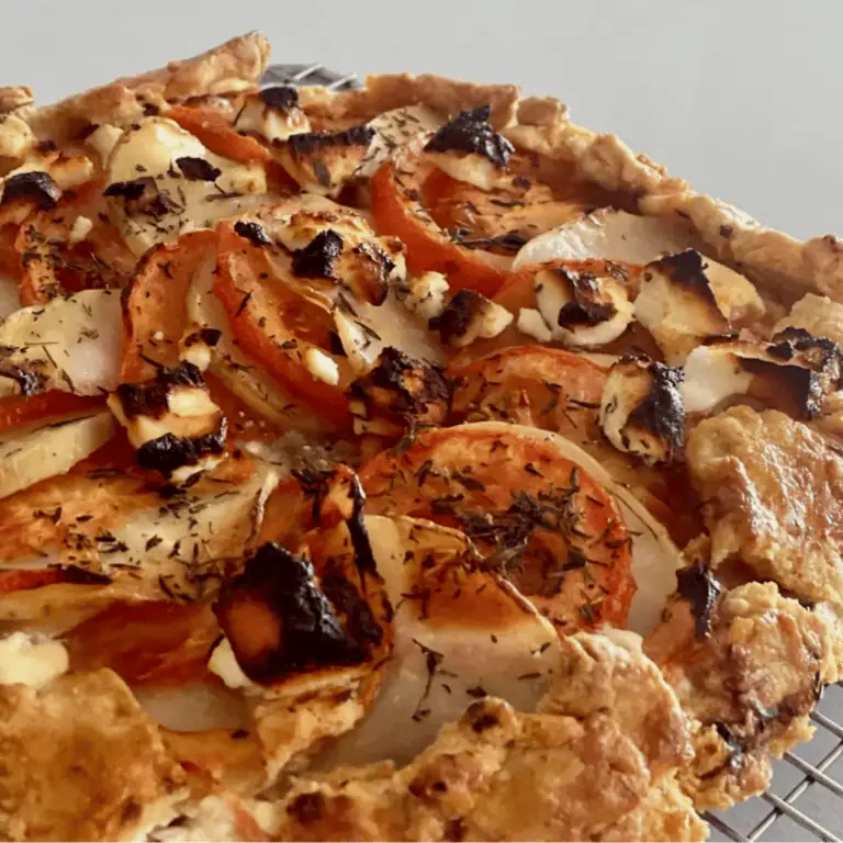Golden roasted vegetable tart with tomatoes, potatoes, and herbs at Fleurieu Food & Wine.