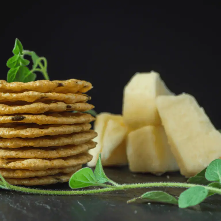 Crunchy gluten-free crackers with cheese and herbs, perfect for wine tasting.