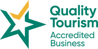 Quality Tourism Accredited Business logo, green and yellow
