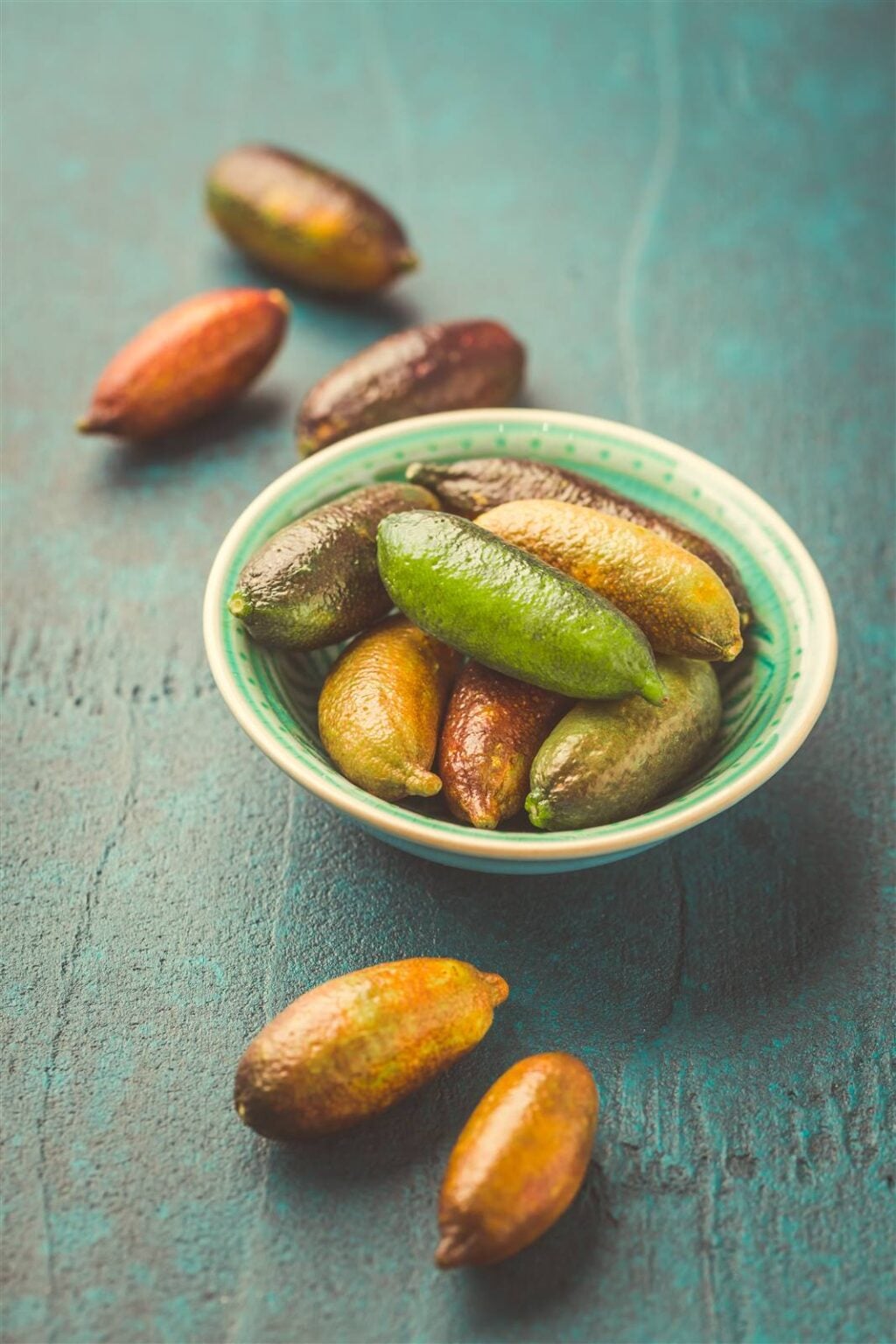 A bowl of whole native finger limes, an Australian native citrus
