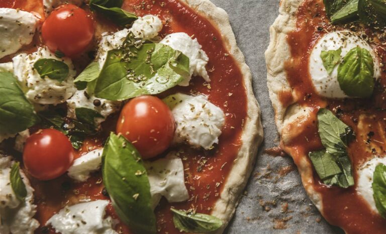 A margherita pizza with tomato, mozzarella and basil