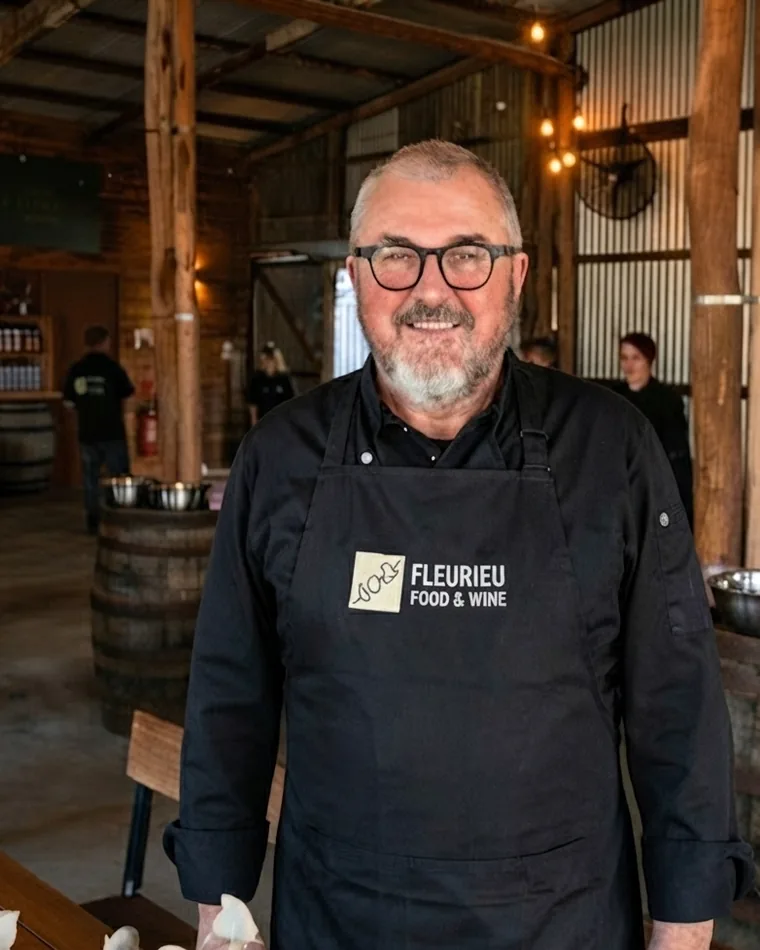 John K in a Fleurieu Food and Wine apron at a class venue