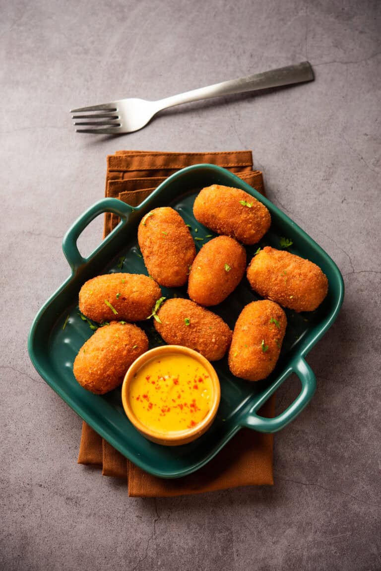 Crispy croquettes with dipping sauce, perfect for Fleurieu Food & Wine tasting events.