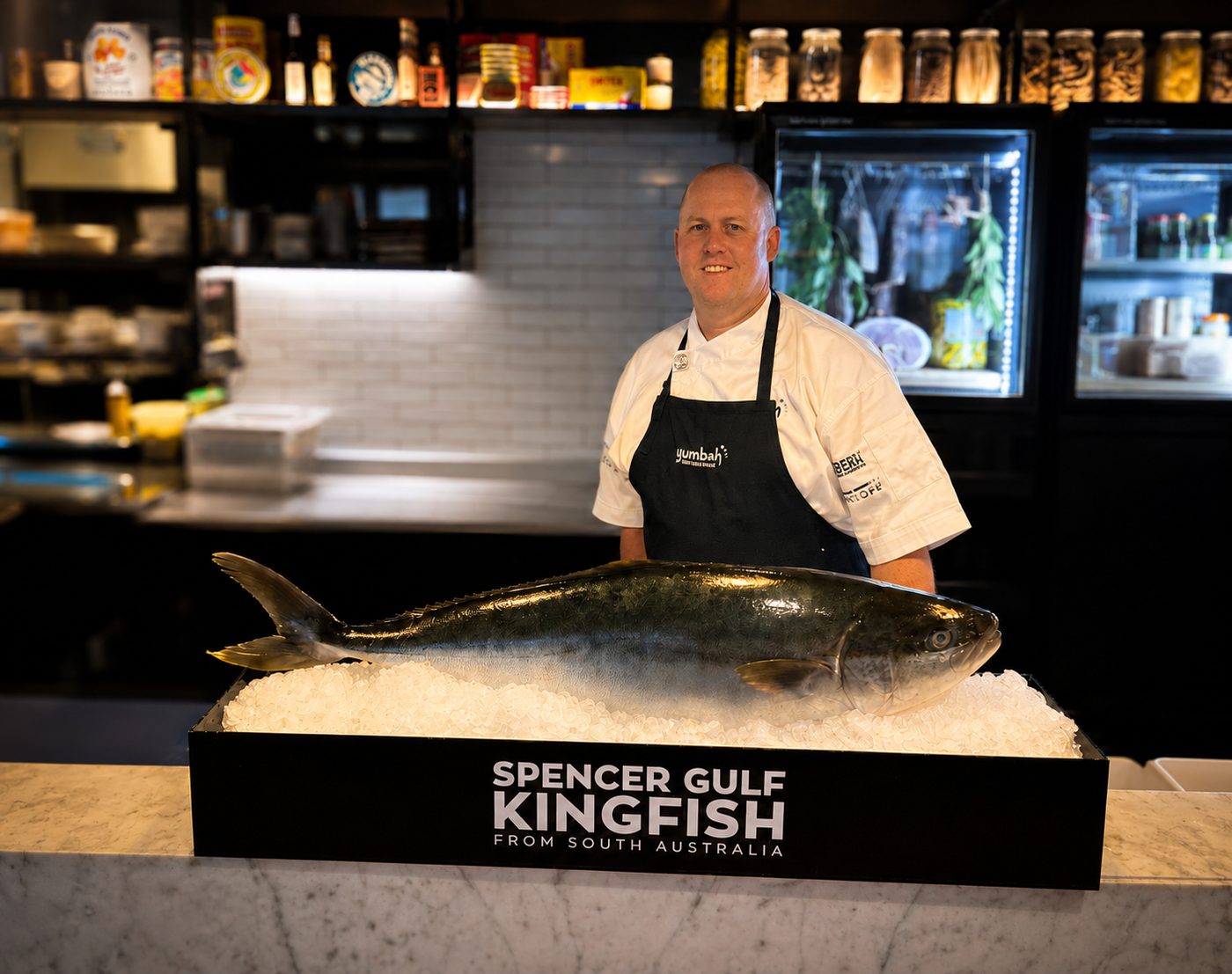 Guest chef Nicholas Finn of Yumbah Aquaculture with a whole South Australian kingfish